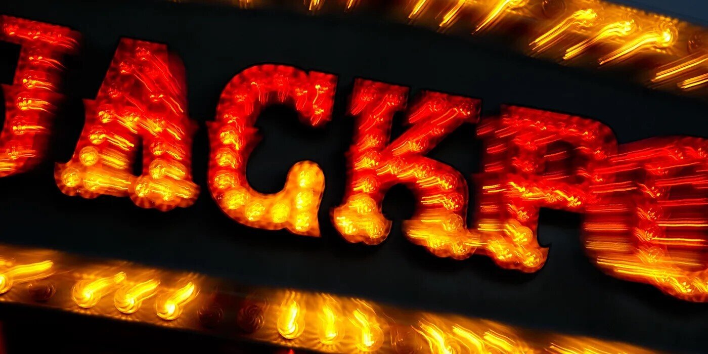 Neon sign writing jackpot in bright orange
